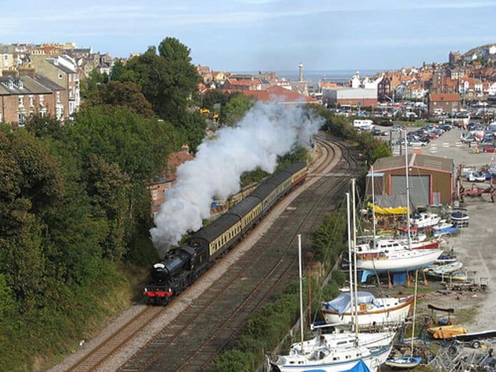 A North Yorkshire Moors Railway steam train leaving Whitby